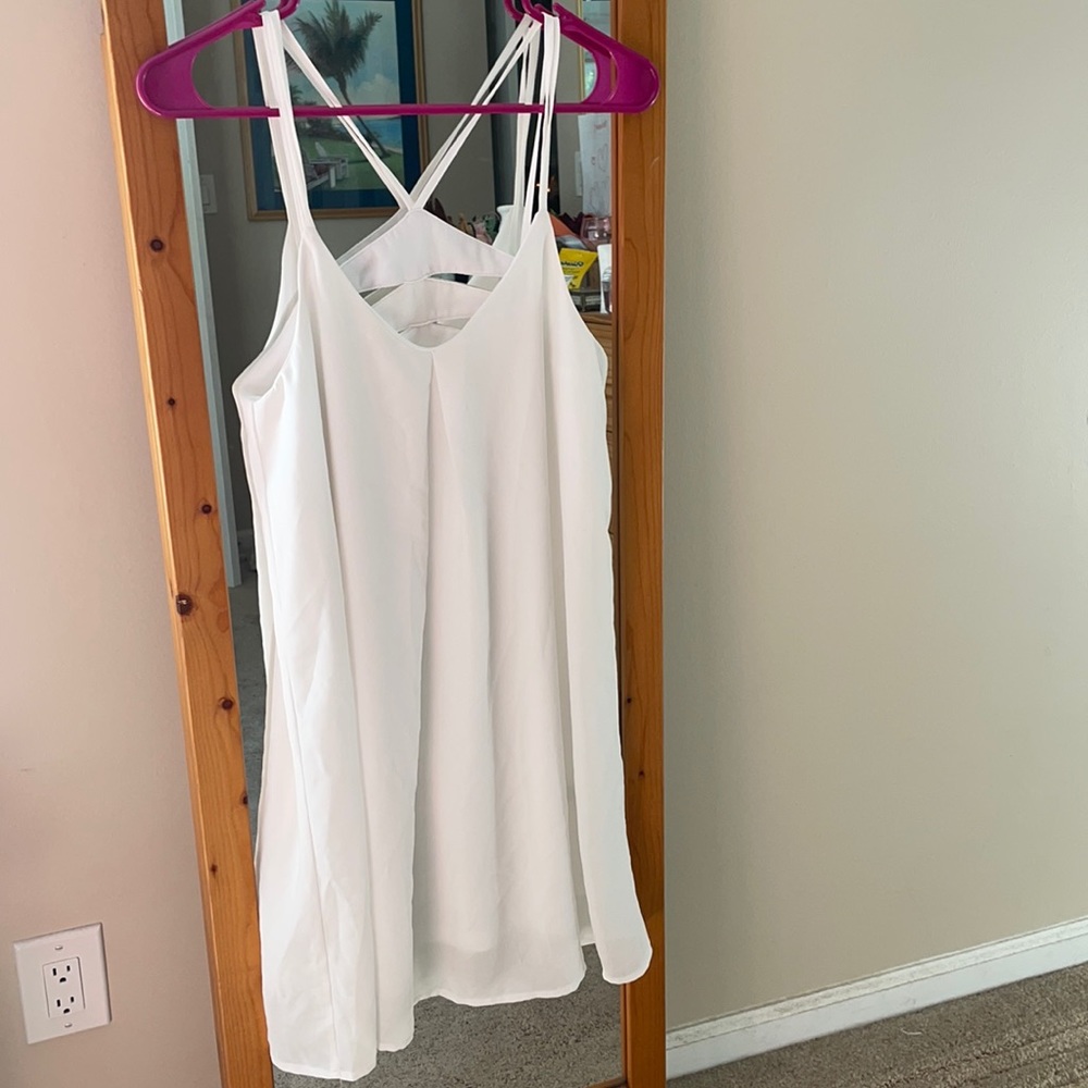 Flowy strappy white dress with back cutout detail